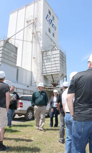 Ed Cooper (center), vice president of operations at the Ethos plant in Brownwood, stands among a group of Canidae marketing and sales employees as they prepare to enter the plant on Stephen F. Austin in Brownwood.
