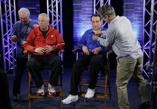 Wisconsin head coach Bo Ryan and Duke head coach Mike Krzyzewski get ready for a CBS Sports interview for the NCAA Final Four college basketball tournament championship game Sunday, April 5, 2015, in Indianapolis.