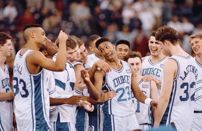 Brian Davis (23) leads the Blue Devils in their celebration following the 1991 national championship game.