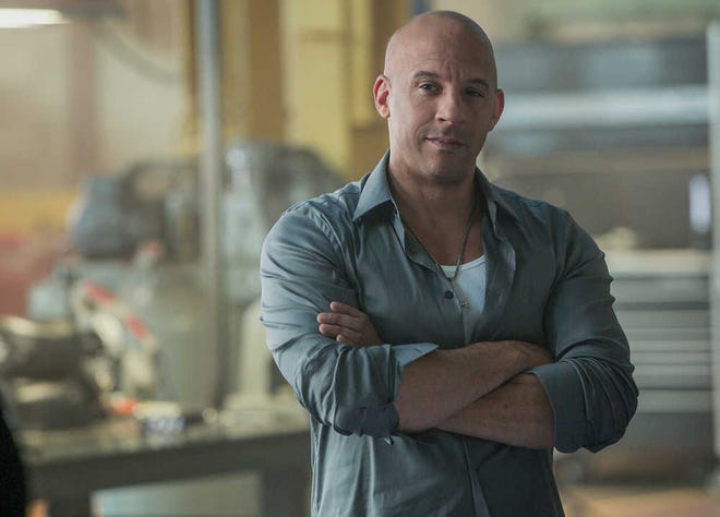 This photo provided by Universal Pictures shows, Vin Diesel as Dom Toretto in a scene from "Furious 7." (AP Photo/Universal Pictures, Scott Garfield)