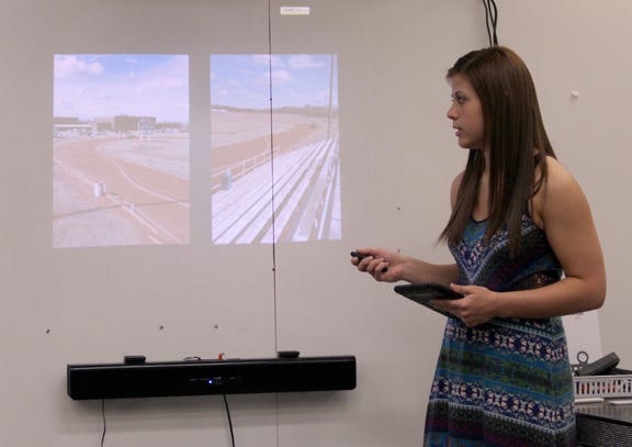 Sydney Koirth presents photos of her driving while texting course at her Kansas Junior Academy of Science presentation.