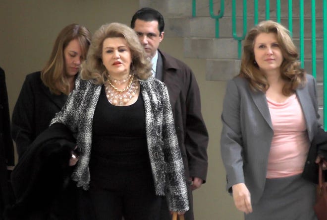 The preliminary hearing for six defendants charged in a $20 million insurance fraud scheme began Monday in Bucks County. Entering the courtroom are (from left to right) Sheila, Claire, Carl and Carla Risoldi.