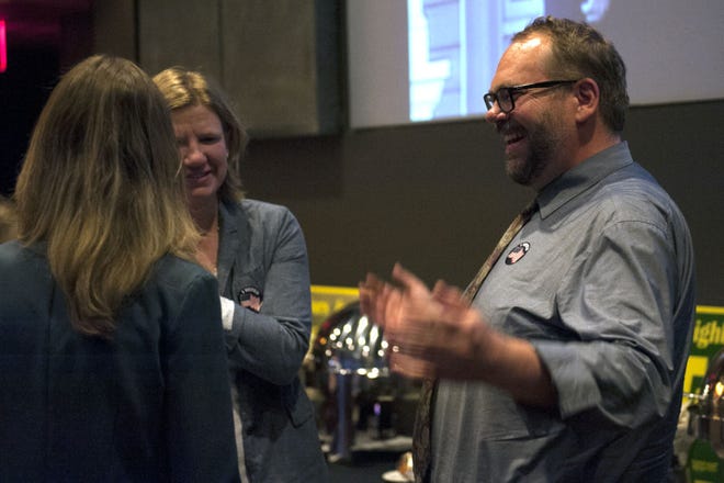Second Ward Councilman Michael Trapp speaks with supporters from left, Ginny Chadwick and Sarah Bantz, Tuesday during an election watch party at the Broadway Hotel in Columbia. Trapp won election to a second term by defeating Paul Love.