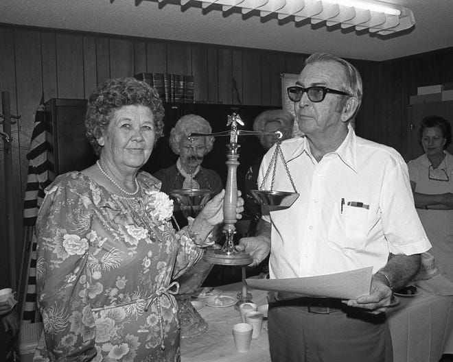 Retiring Flagler County Supervisor of Elections Mary Smith present scales to Circuit Court Clerk Shelton Barber in this October 1979 photo.