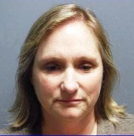 Judith Ritacco, Bridgewater State University day care director, shown in her booking photo on Wednesday, April 8, 2015, at the campus police department.