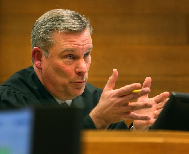 Lane County Circuit Judge Karsten Rasmussen listens to arguments in the Lane County Courthouse in Eugene, Ore. on Tuesday, April 7, 2015 by the plaintiffs in Chernaik v. Brown. The case was brought by two Eugene teenagers in 2011 seeking a court ruling that forces state lawmakers to implement a plan that would reduce carbon emissions to stave off climate change. Rasmussen dismissed the case in 2012 — saying at the time that he was being asked to do a job that should fall to the Legislature and the governor — but it bounced back to him after the Oregon Court of Appeals ruled last year that he does have jurisdiction to consider the lawsuit’s merits. (Brian Davies/The Register-Guard)