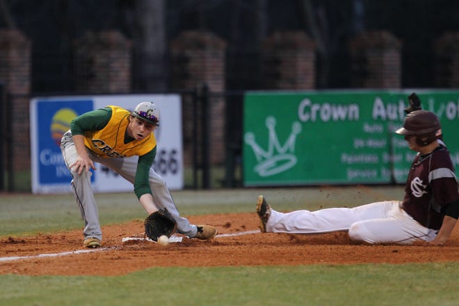 Crest third baseman Chase Halbert takes a throw to retire a South Caldwell runner during Wednesday's Shelby Easter Tournament contest at Keeter Stadium/Veterans Field. The Spartans downed Crest, 5-2, to make Thursday's title round. (Hannah Covington / The Star)