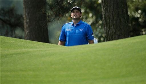 Patrick Reed watches his shot to the eighth green during the first round of the Masters golf tournament Thursday, April 9, 2015, in Augusta, Ga. (AP Photo/Charlie Riedel)