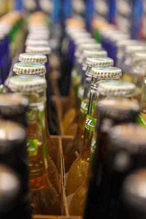 Beer bottles line a shelf at Bell's Food Store in Athens, Ga., Friday, March 29, 2013. (AJ Reynolds/Staff)
