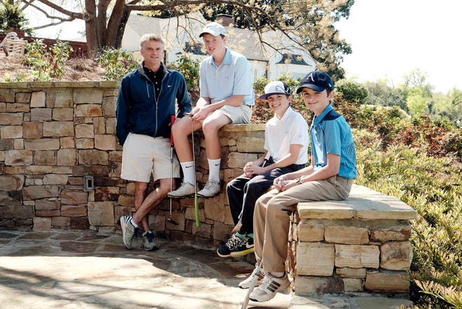 Turner Simkins, with his sons (from left) Nat, Christopher and Brennan at Augusta Country Club, has written a book about his family's journey as son, Brennan, endured four bone marrow transplants.
