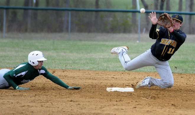 Bordentown's Cody Schroeder (11) attempts to tag out Pemberton's Antoine Wilson (21) during Thursday April 9, 2015 baseball game at Pemberton High School.