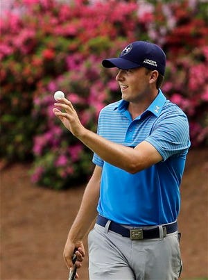WHO IS BREAKING OUT AT GOLF'S FIRST MAJOR: Jordan Spieth flirts with the major championship scoring record at the Masters, shooting an 8-under 64 and taking a three-shot lead heading into the second round.