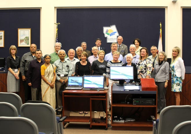 Graduates of the ninth Flagler County Citizens Academy with Flagler County commissioners at the conclusion of the program.