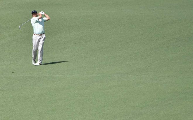 Non-competing marker Jeff Knox hits his second shot on No. 9 fairway during the third round of the Masters Tournament at Augusta National Golf Club, Saturday, April 11, 2015, in Augusta, Georgia. (SARA CORCE/STAFF)