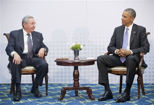 U.S. President Barack Obama, right, meets with Cuban President Raul Castro at the Summit of the Americas in Panama City, Panama on Saturday, April 11, 2015. The leaders of the United States and Cuba held their first formal meeting in more than half a century on Saturday, clearing the way for a normalization of relations that had seemed unthinkable to both Cubans and Americans for generations.