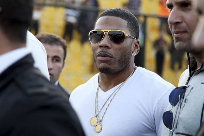 Rapper Nelly approaches the stage for a concert in Irbil, northern Iraq. Nelly is facing felony drug charges after being arrested in Tennessee, Saturday, April 11, 2015, according to a Tennessee Highway Patrol news release.