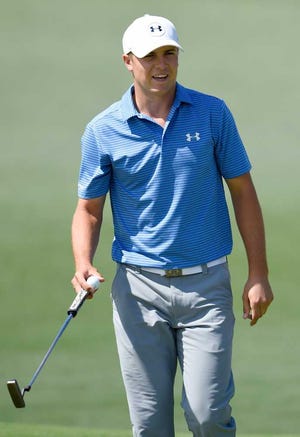 Jordan Spieth smiles after making birdie on No. 2 during the third round of the Masters Tournament at Augusta National Golf Club, Saturday, April 11, 2015, in Augusta, Georgia. (MICHAEL HOLAHAN/STAFF)