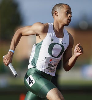 Oregon’s Marcus Chambers takes off on the anchor leg of the men’s 4x400-meter relay on Saturday. (Andy Nelson/The Register-Guard)