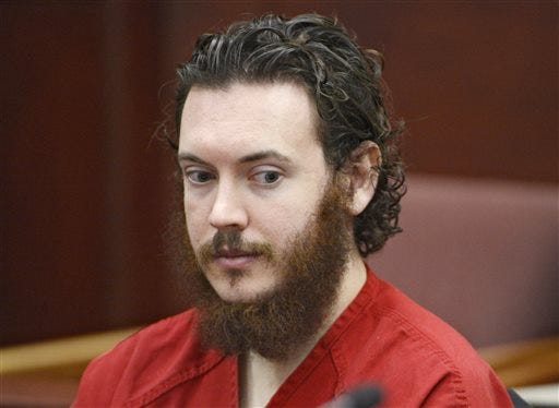 In this June 4, 2013, file photo, Aurora, Colo., theater shooting defendant James Holmes appears in court in Centennial, Colo. Taxpayer costs for the Colorado theater shooting case have risen to at least $2.2 million before the trial has even started. That figure doesn't include legal costs for the defendant. The Holmes trial is expected to start April 27. (AP Photo/The Denver Post, Andy Cross, Pool, File)
