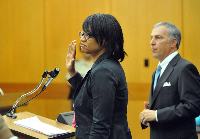 Former Atlanta Public Schools Dobbs Elementary school principal Dana Evans asks for leniency during sentencing. A judge postponed sentencing until Tuesday for 10 of the 11 defendants convicted of racketeering in a scheme inflating students' test scores.