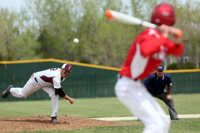 Buhler’s Dakota Wolf (3) delivers a pitch to McPherson’s Caleb Schmidt (5) during the first game of their doubleheader at Wray Field on Monday, April 13, 2015.