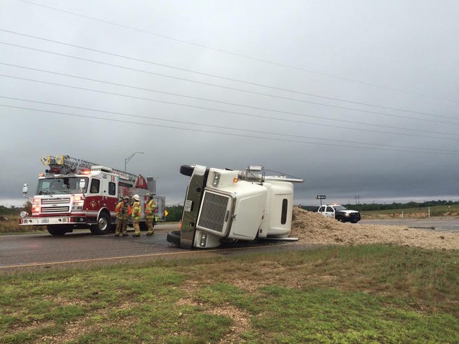 A tractor-trailer hauling cotton rolled over at 50th Street and the East Loop on Monday morning, Lubbock police confirm.