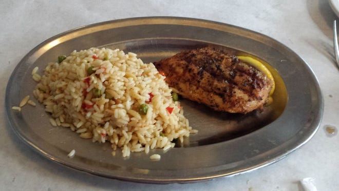 Lemon-Rosemary Chicken with rice pilaf from Symeon's Greek Restaurant in Yorkville.