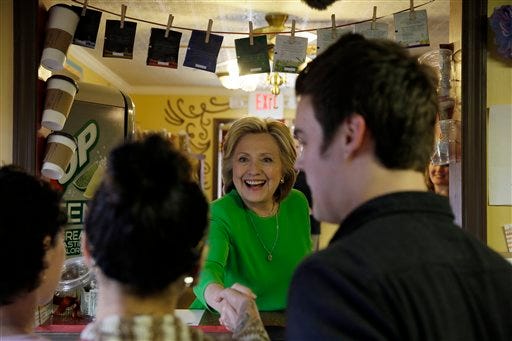 Democratic presidential candidate Hillary Rodham Clinton meets with local residents at the Jones St. Java House, Tuesday, April 14, 2015, in LeClaire, Iowa. (AP Photo/Charlie Neibergall)