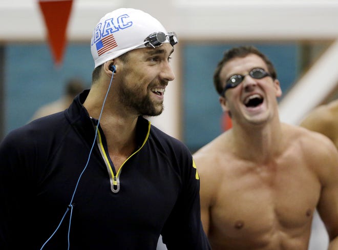 Michael Phelps, left, laughs with Ryan Lochte before the men's 100-meter backstroke at the Bulldog Grand Slam swim meet in 2014. The two could meet again at this week's Arena Pro Swim Series event in Mesa, Arizona.