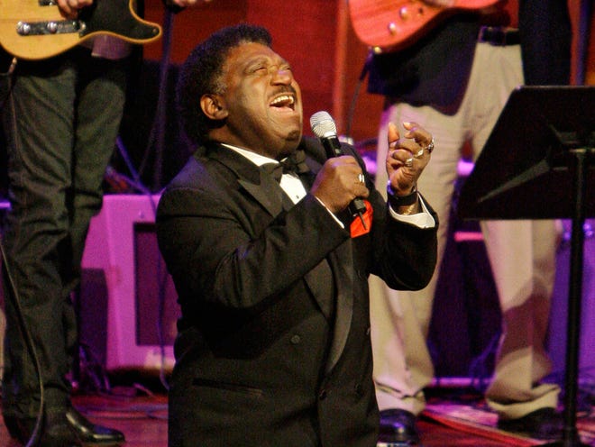 Percy Sledge kneels as he performs "When a Man Loves a Woman" along with the Muscle Shoals Rhythm Section at the 2008 Musicians Hall of Fame awards show in Nashville, Tenn.