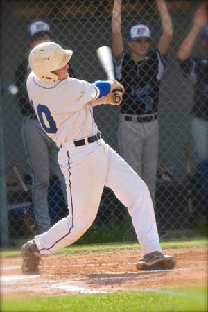 Bethel Christian Academy’s Daniel Daugherty hits a home run over the left field fence to extend the Trojans’ lead over Wilmington Christian to 2-0 in Monday’s win at Sutton Field.