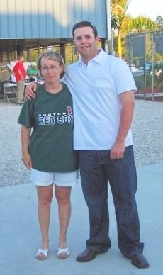 Cheri Giffin of Randolph, right, met her future favorite Red Sox player, Dustin Pedroia, at spring training a decade ago.
