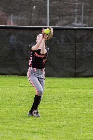 Emma Mizner of Sturgis snags a pop fly in right field Tuesday night.