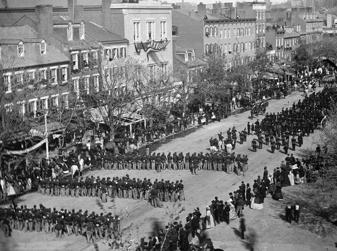 his April 19, 1865 photo made available by the Library of Congress shows a procession for President Abraham Lincoln's funeral on Pennsylvania Avenue in Washington.