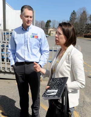 Mass. Clean Energy Center CEO Alicia Barton speaks on an economic development tour in Ashland Monday. At left is United Home Experts owner John Dudley, whose business was the second stop on the tour. 

Daily News Staff Photo/Art Illman
