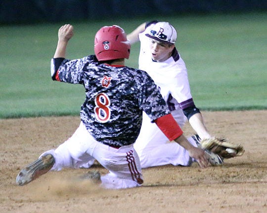 Brownwood second baseman Cole Fowler (background) slaps a tag on Mineral Wells’ Frank Johnson (8), who was attempting to steal, during the Lions’ 8-5 home loss Wednesday night.