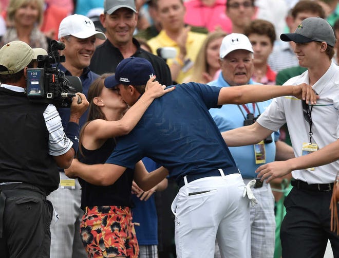 Jordan Spieth gets a kiss from his girlfriend, Annie Verret, after winning the 2015 Masters at Augusta National Sunday April 12, 2015, in Augusta, Ga.  (AP Photo/Atlanta Journal-Constitution, Brant Sanderlin) MARIETTA DAILY OUT; GWINNETT DAILY POST OUT; LOCAL TELEVISION OUT; WXIA-TV OUT; WGCL-TV OUT