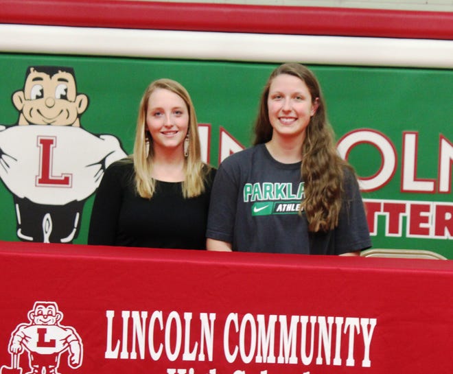 Lincoln’s Katlyn Hasprey (left) and Megan Jackson (right) signed their letters of intent on Wednesday in the high school gym. Photo by Bill Welt/The Courier
