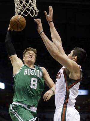 The Celtics' Jonas Jerebko goes up for a dunk during Boston's 105-100 win over the Bucks on Wednesday night in the season finale for both teams.