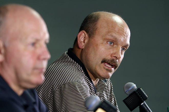 Peter Chiarelli, right, speaks to reporters along with head coach Claude Julien on Monday.