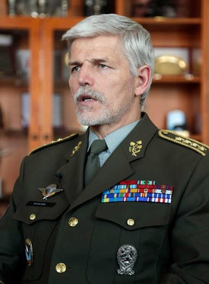 Gen. Petr Pavel, new head of NATO's Military Committee, answers a question during an interview with The Associated Press in Prague, Czech Republic, Wednesday, April 15, 2015. Pavel said that the western military alliance has to convince the public it has the means and will to confront Russia. (AP Photo/Petr David Josek)