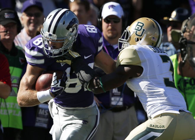 Kansas State wide receiver Kyle Klein makes a reception against Baylor during the 2013 season. Klein, younger brother of former Wildcat All-American quarterback Collin Klein, missed all of last season with a back injury but has impressed during spring drills.