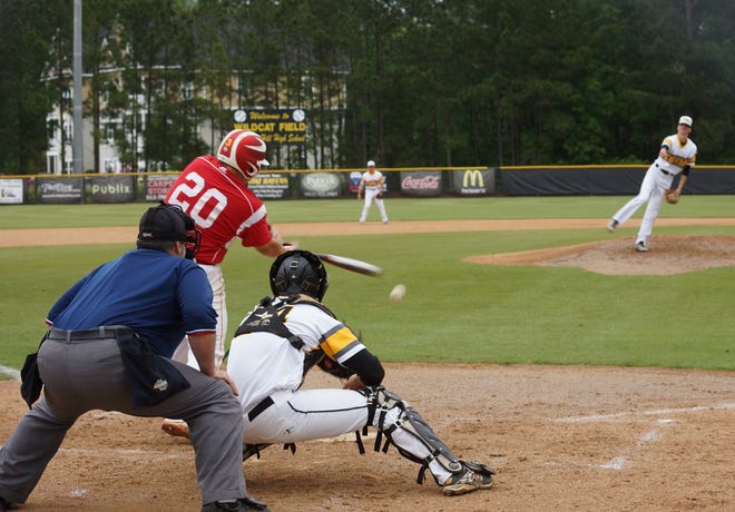 RHHS pitcher Kyle Lugis gets Glynn Academy third baseman Cody Norton (20) to swing and miss at strike three in the Wildcats' 6-1 win Thursday.
