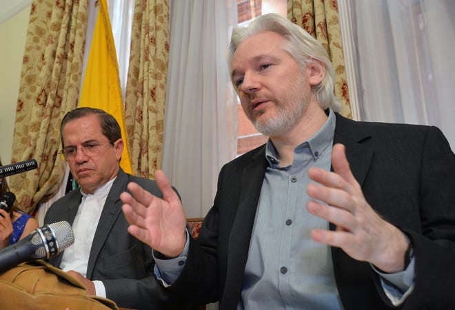 FILE - In this Aug. 18, 2014, file photo, Ecuador's Foreign Minister Ricardo Patino, left, and WikiLeaks founder Julian Assange speak during a news conference inside the Ecuadorian Embassy in London. Whistleblower site WikiLeaks has put hundreds of thousands of emails and documents from last year's Sony hack into a searchable online archive. Assange says that its database includes more than 170,000 emails from Sony Pictures Entertainment and a subsidiary, plus more than 30,000 other documents. (John Stillwell/Pool Photo via AP, File)