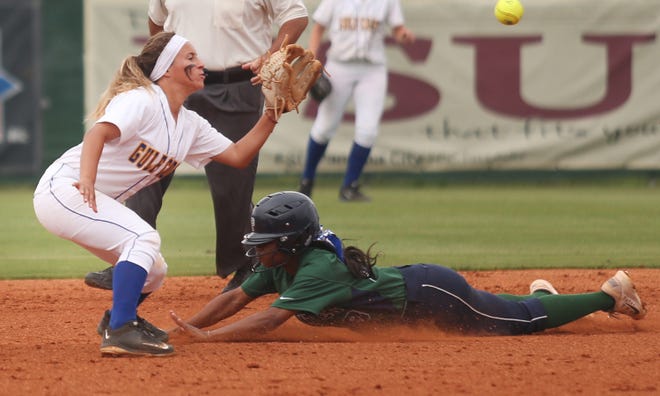 Pensacola’s Bevia Robinson easily steals second base as Gulf Coast shortstop Jazmine Lewis reaches for a late throw.