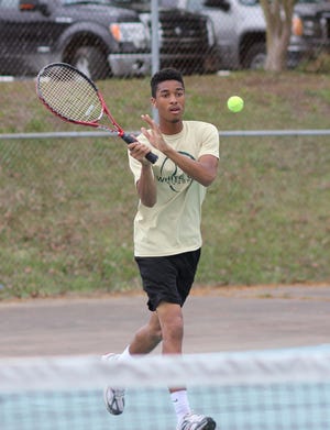 White Oak’s Josh Davis returns the ball during his 6-0, 6-1 win at No. 4 singles Thursday in the Vikings’ 9-0 win over Richlands.