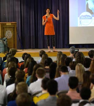 Jennifer Phar Davis speaks to high school students at Parrott Academy on Wednesday. Davis, a hiker and writer, traversed the entire Appalachian Trail in 46 days, 11 hours and 20 minutes, the fastest known time.