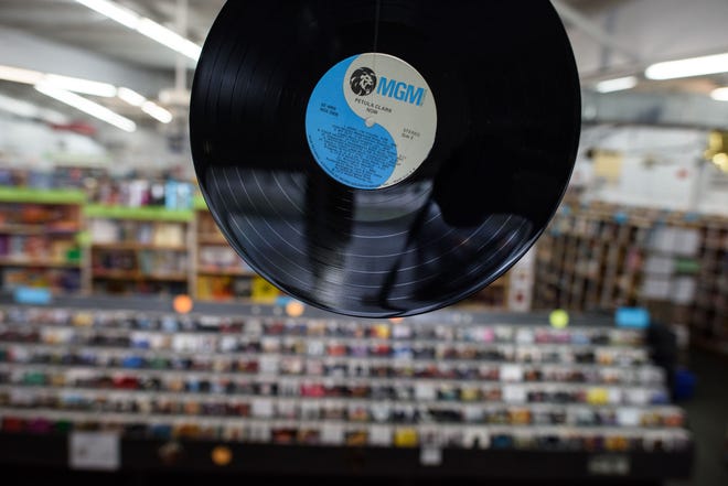 A record hangs from the ceiling in honor of Record Store Day at Edward McKay Used Books & More on Bragg Boulevard.