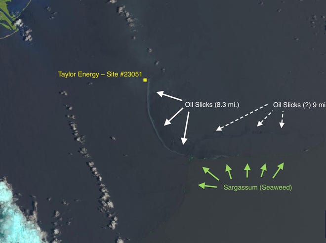 This June 21, 2014, satellite photo from NASA, annotated by SkyTruth, shows an oil slick extending in an arc at least 8.3 miles long from a well site at a Taylor Energy Co. platform, which was toppled in an underwater mudslide triggered by Hurricane Ivan's waves in September 2004. The white cotton-like formations are clouds, and the mouth of the Mississippi River is visible in the green land mass at the upper left.