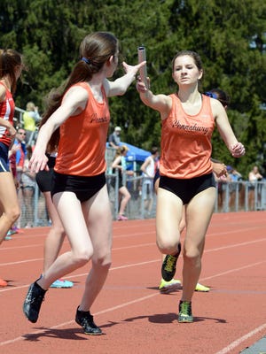 Pennsbury's Erin O'Connell (R) hands off to teammate Hannah Molloy in the 4x800 relay at the Central Bucks West Relays Saturday April 18, 2015 in Doylestown, Pennsylvania. (Photo by William Thomas Cain/Cain Images)